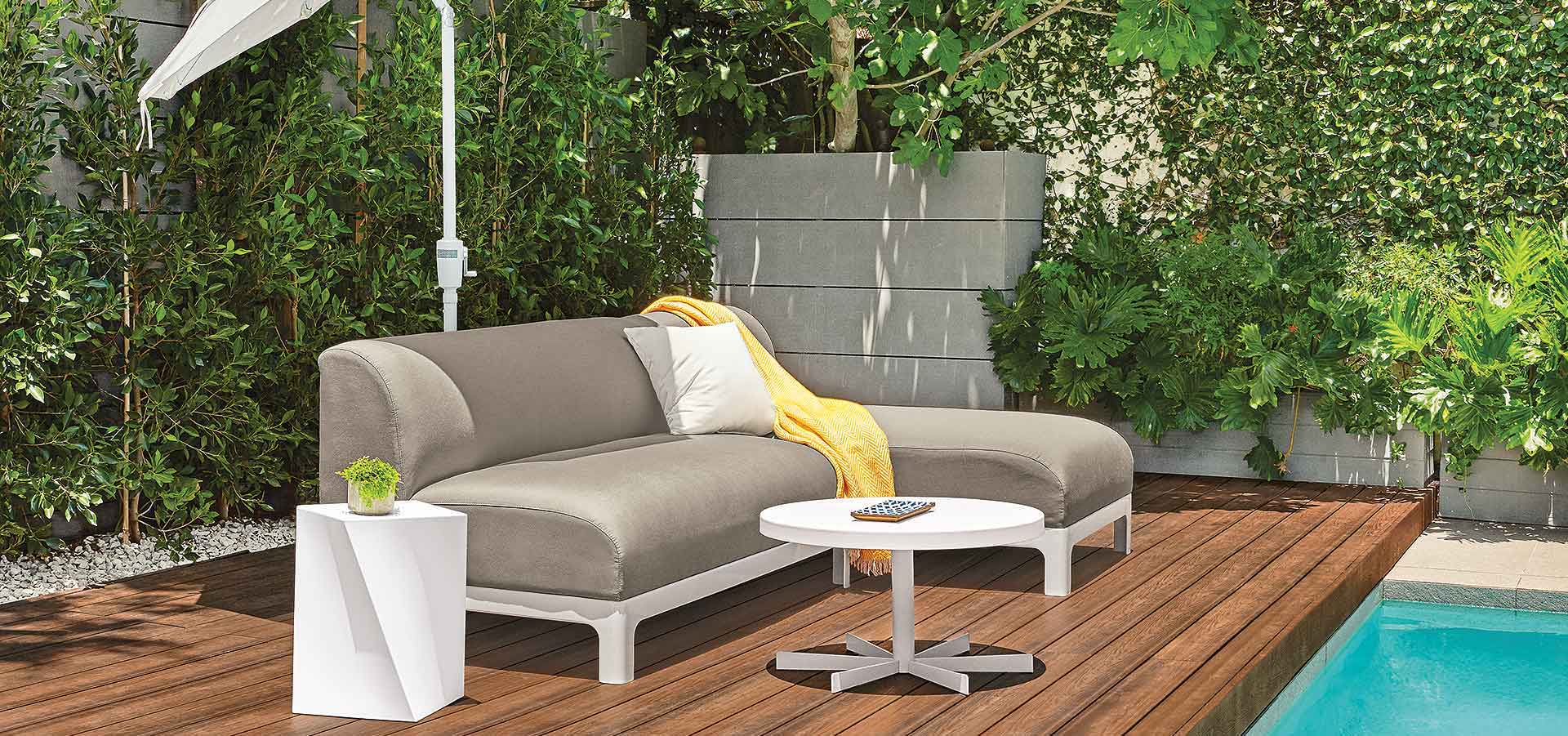 Crescent outdoor sofa/chaise with Gehry cube end table